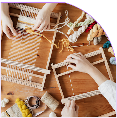 People weaving on looms