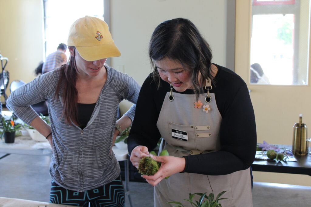 Samantha Leung teaching a kokedama class at Camp Craftaway 2023